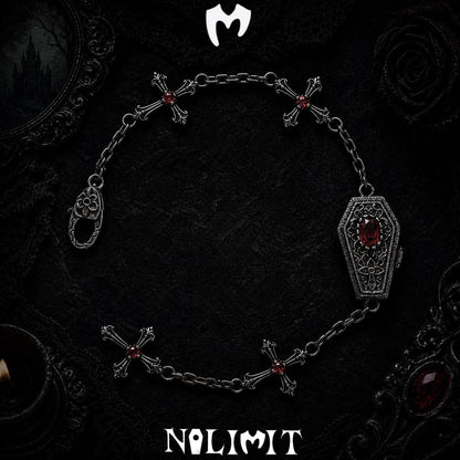 Red sterling silver coffin cross bracelet on a black gothic background