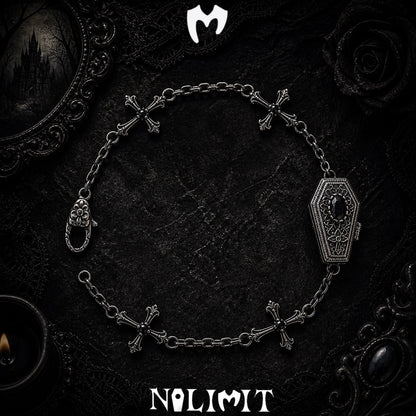 Black sterling silver coffin cross bracelet on a black gothic background