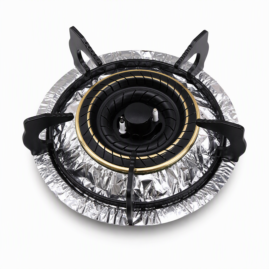 Circle aluminum foil burner liner shown around a burner assembly